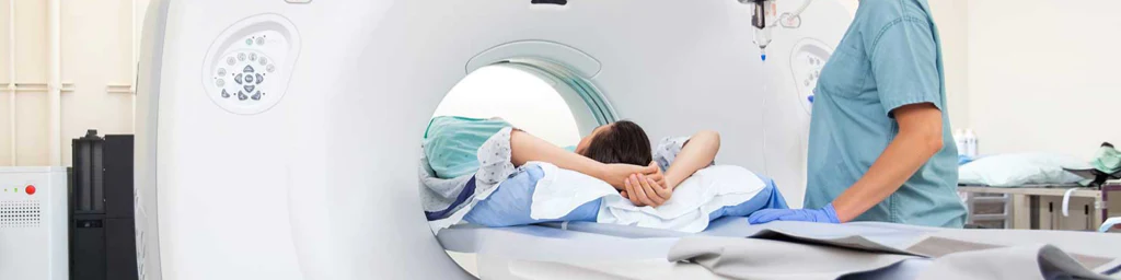 Photo of a man undergoing CT scan to diagnose kidney stones