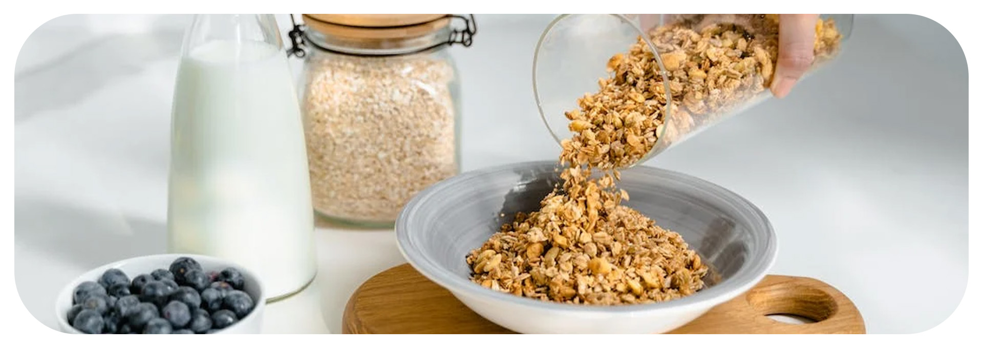 Pouring Granola on a bowl.