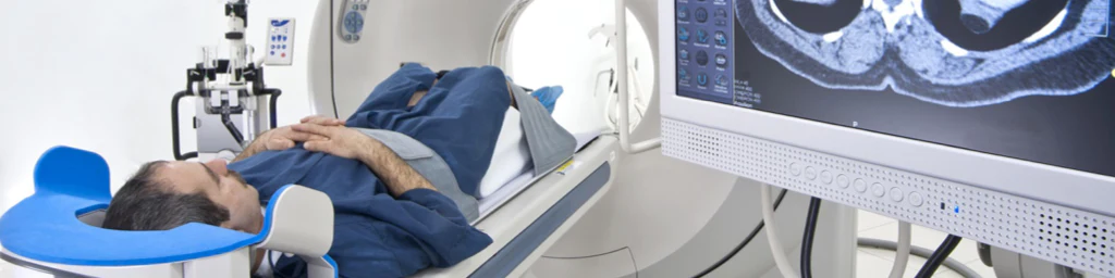 Photo of a man undergoing s CT scan